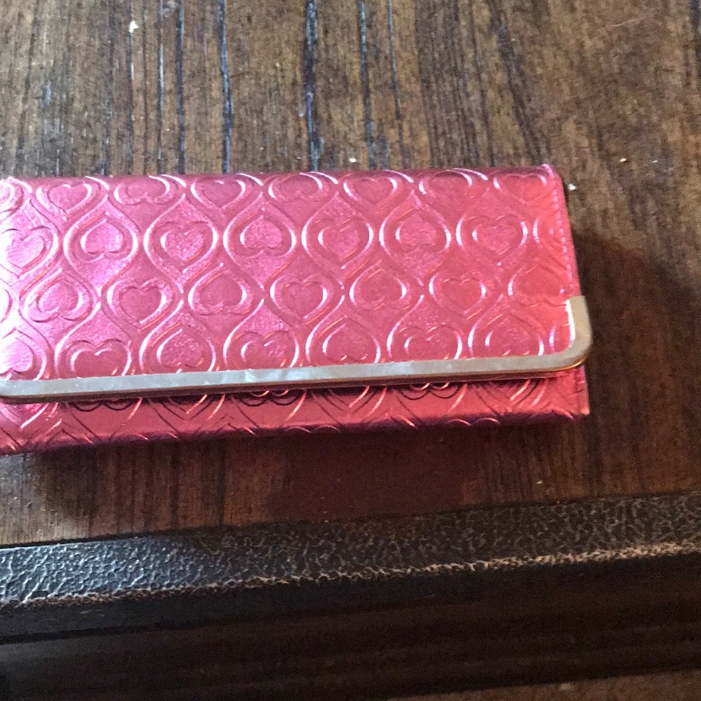 Here women wallet with heart all over it